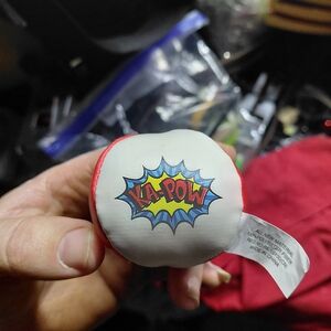 small, plush, or foam toy designed to look like a comic book "Ka-Pow